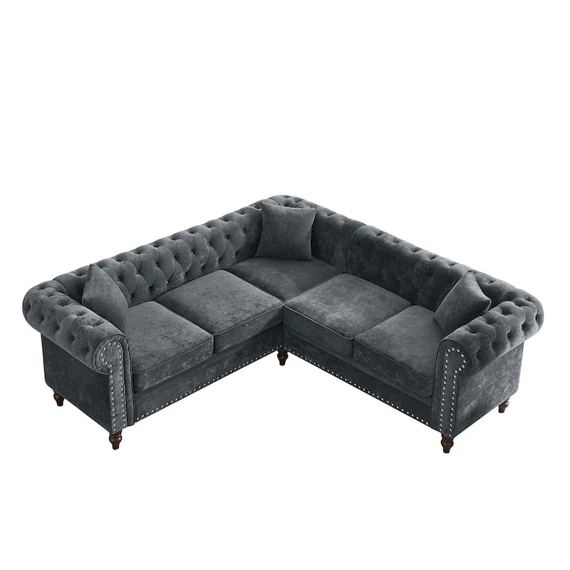 Chesterfield Ecksofa mit tiefer Knopfheftung, gerollten Armlehnen und L-Form