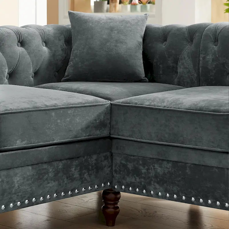 Chesterfield Ecksofa mit tiefer Knopfheftung, gerollten Armlehnen und L-Form
