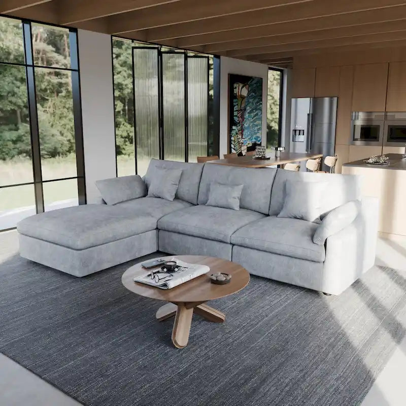 L-förmiges Sofa mit Leinenbezug, mehreren Kissen und Chaiselongue