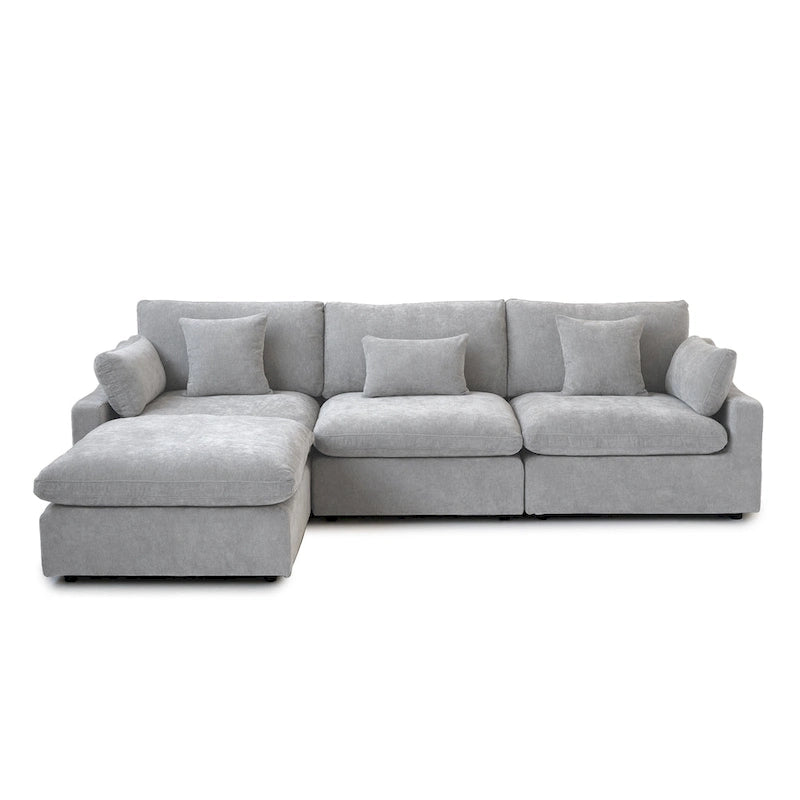 L-förmiges Sofa mit Leinenbezug, mehreren Kissen und Chaiselongue