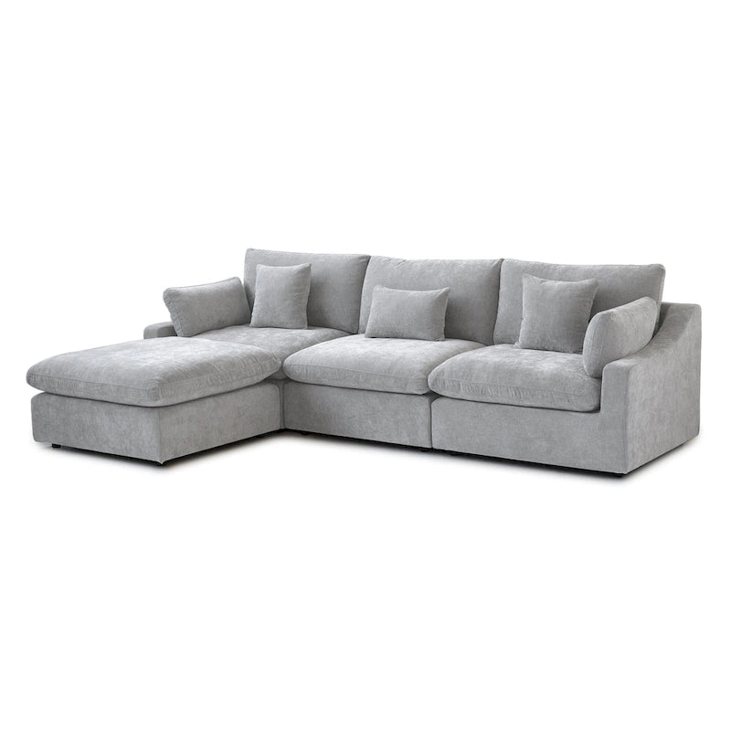 L-förmiges Sofa mit Leinenbezug, mehreren Kissen und Chaiselongue