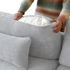 L-förmiges Sofa mit Leinenbezug, mehreren Kissen und Chaiselongue