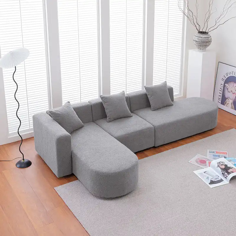 Modernes L-förmiges Bouclé-Sofa mit geschwungener Sitzfläche (linke Ausrichtung)