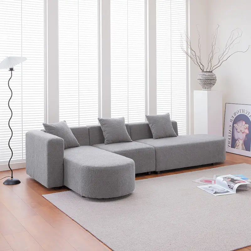 Modernes L-förmiges Bouclé-Sofa mit geschwungener Sitzfläche (linke Ausrichtung)