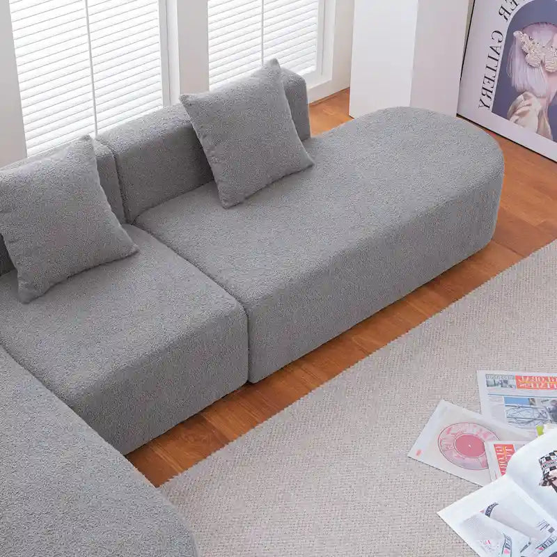 Modernes L-förmiges Bouclé-Sofa mit geschwungener Sitzfläche (linke Ausrichtung)