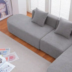 Modernes L-förmiges Bouclé-Sofa mit geschwungener Sitzfläche (rechtsseitig ausgerichtet)