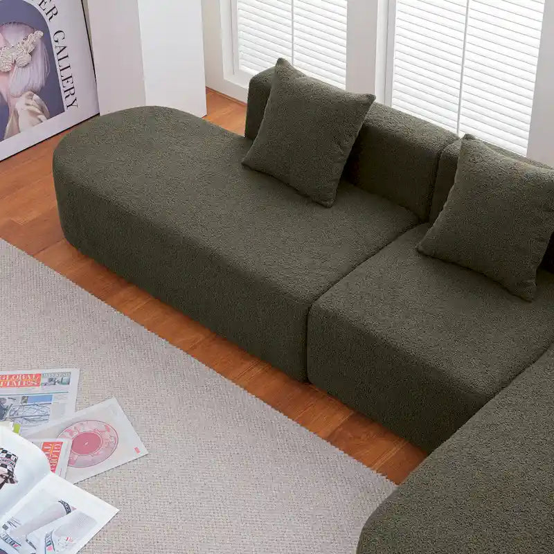 Modernes L-förmiges Bouclé-Sofa mit geschwungener Sitzfläche (rechtsseitig ausgerichtet)