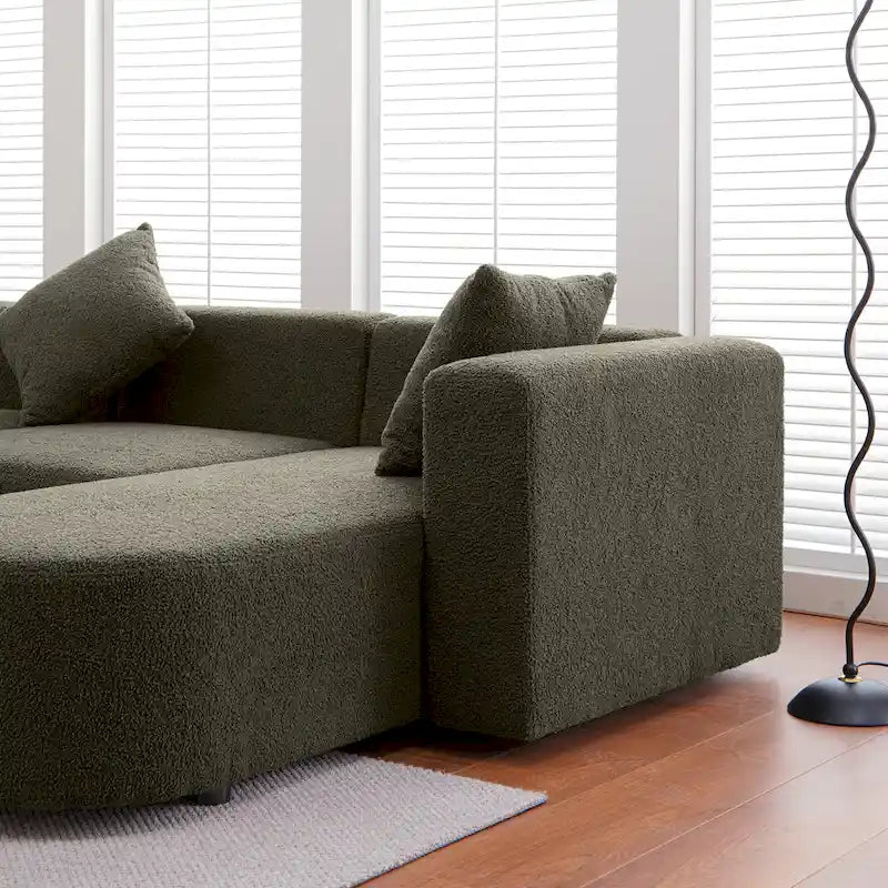 Modernes L-förmiges Bouclé-Sofa mit geschwungener Sitzfläche (rechtsseitig ausgerichtet)