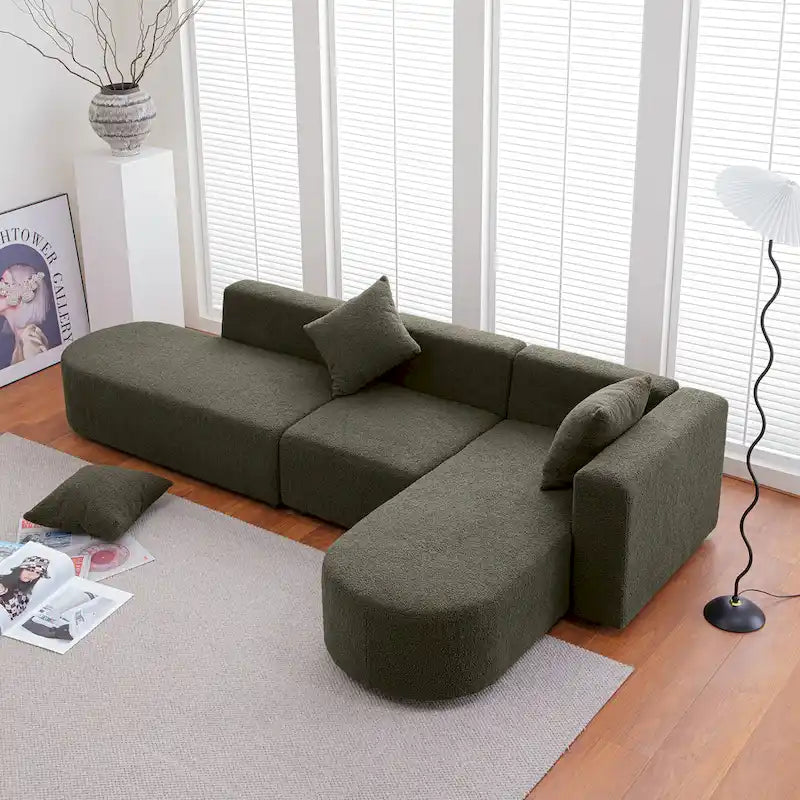 Modernes L-förmiges Bouclé-Sofa mit geschwungener Sitzfläche (rechtsseitig ausgerichtet)
