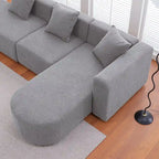 Modernes L-förmiges Bouclé-Sofa mit geschwungener Sitzfläche (rechtsseitig ausgerichtet)