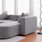 Modernes L-förmiges Bouclé-Sofa mit geschwungener Sitzfläche (rechtsseitig ausgerichtet)